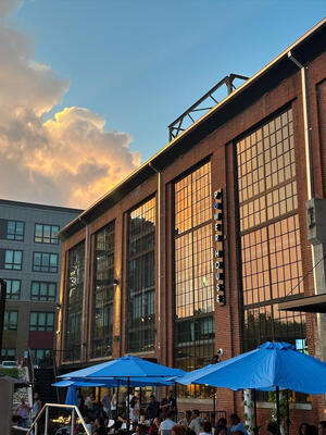 The Power House Apartments exterior at golden hour showing original 1920s industrial brickwork in Rock Hill, SC