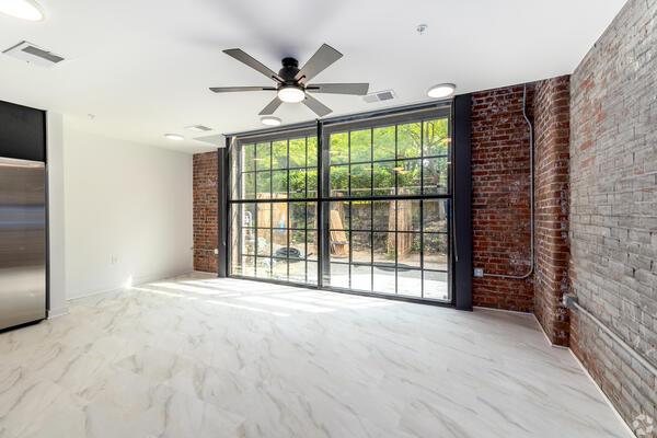 Close-up of original industrial brickwork and modern finish detail inside a Power House Apartments unit
